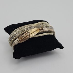 NWT 2 Chic cream and silver layered wrap bracelet with gold tone feather